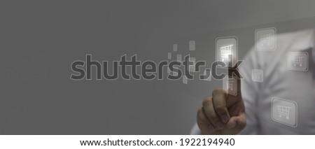 Businessman touches the cart icon.concept online shopping 