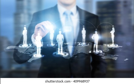 Businessman touching businessperson silhouette icon on networking system - Shutterstock ID 409968937