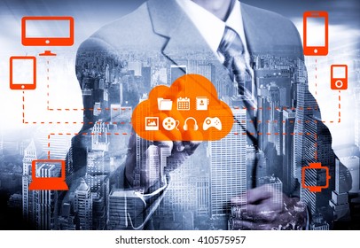 Businessman touching a cloud connected to many objects on a virtual screen, concept about internet of things. - Powered by Shutterstock