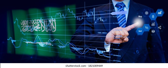 Businessman touching data analytics process system with KPI financial charts, dashboard of stock and marketing on virtual interface. With Saudi Arabia flag in background.