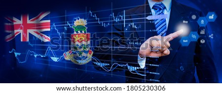 Businessman touching data analytics process system with KPI financial charts, dashboard of stock and marketing on virtual interface. With Cayman Islands flag in background.