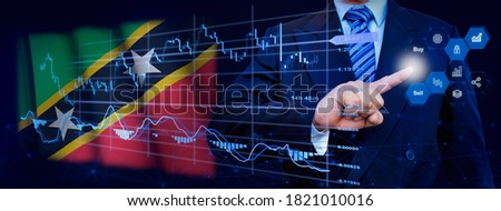Businessman touching data analytics process system with KPI financial charts, dashboard of stock and marketing on virtual interface. With Saint Kitts and Nevis flag in background.
