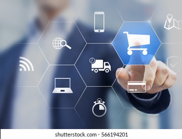 Businessman touching e-commerce button on a virtual interface with icons of shopping cart, delivery, credit card and wireless web, concept about online purchase on internet - Shutterstock ID 566194201
