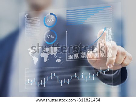 Businessman touching financial dashboard with key performance indicators
