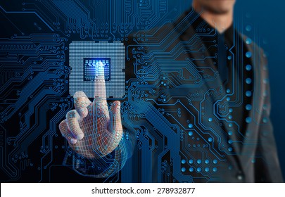 businessman touching glow CPU and electronics circuit