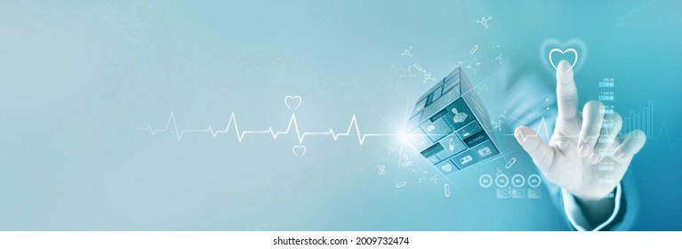 Businessman touching heart shape of service mind  and healthcare business graph growth and medical icon on cube,  Medical examination, medicine, Data analysis on network screen, Medical business.  