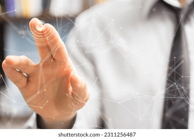 A businessman touching network lines- communication and networking concept - Shutterstock ID 2311256487