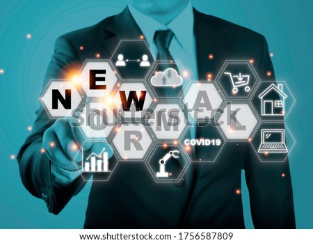 Businessman touching new normal wording with icon such as online shopping social distancing work from home and COVID19.The world is changing to balance it into new normal include business , economy , 