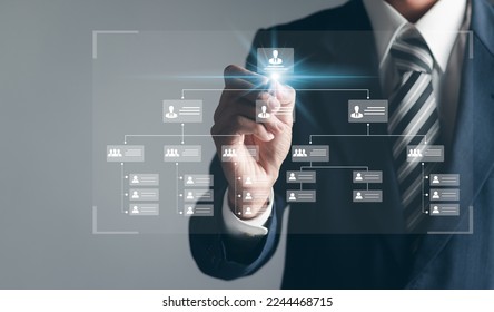 Businessman touching organization chart on virtual interface screen. Business process and workflow automation with flowchart. Hierarchical structure of teams and employees in the company.