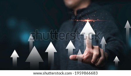 Businessman touching rise up white arrow for business and profit growth concept.