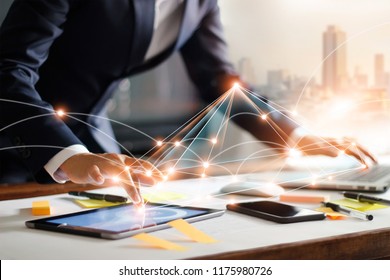 Businessman touching tablet and laptop. Management global structure networking and data exchanges customer connection on workplace. Business technology and digital marketing network concept.