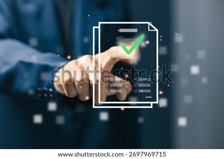 Businessman touching virtual document with checkmark icon. Concept of digital approval, e-signature, online verification, and paperless office technology in modern business.