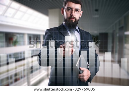 Businessman touching virtual screen with graph. Business, internet, technology concept.