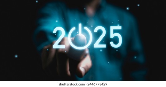 Businessman touching to virtual start button icon with 2025 for start merry Christmas and happy new year concept.