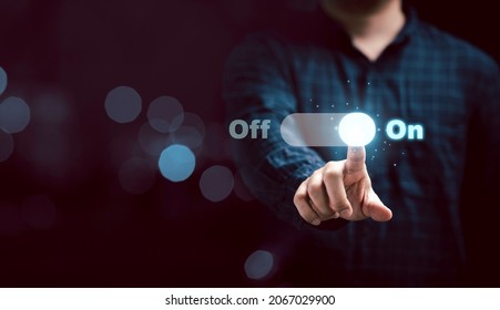 Businessman touching to virtual toggle switch button for change from off to on.