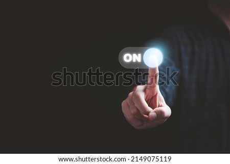Businessman touching to virtual toggle switch button for change from off to on.