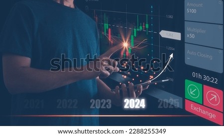 Businessman or trader is using smartphone and virtual hologram stock, invest in trading, planning analyze indicator and strategy for year 2024 buy and sell, Stock market, Business growth