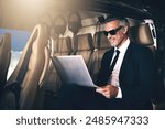 Businessman, travel and flying with laptop of FBI, spy or secret service for surveillance in helicopter. Happy man or special agent on computer or technology in air or flight for safety or coverage