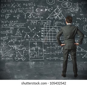 Businessman tries to solve problems - Shutterstock ID 105432542