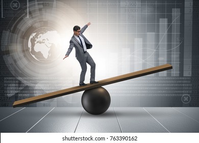 Businessman Trying Balance On Ball Seesaw Stock Photo (Edit Now) 789431356