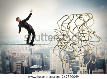 Businessman trying to solve a confusing problem