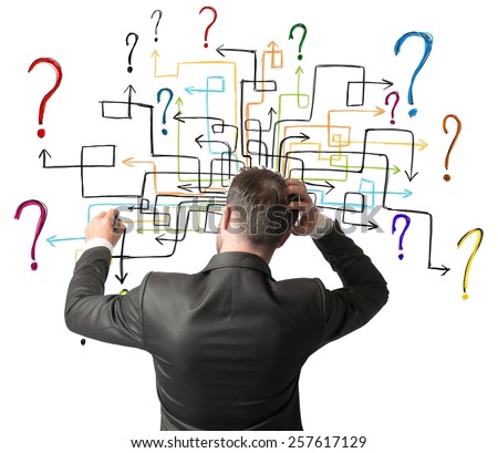 Businessman trying to solve a maze questions