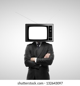 businessman with tv head on a gray background