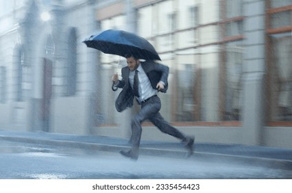 Businessman with umbrella running across rainy street - Powered by Shutterstock