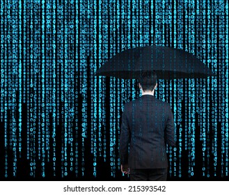 Businessman with the umbrella standing in front of Matrix background