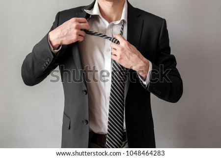 Businessman untying tie, business and work concept 商業照片 © 