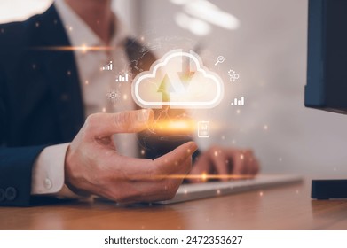 Businessman use computer with cloud computing diagram show on hand. Cloud technology. Data storage. Networking and internet service concept