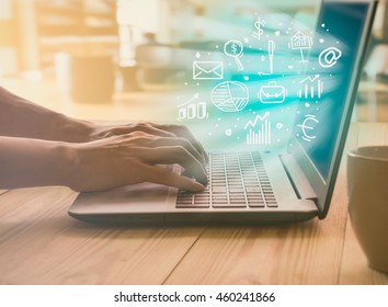 Businessman use laptop and smartphone for routine working on wood office table. Business concept. - Shutterstock ID 460241866