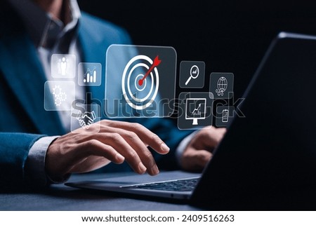 Businessman use laptop with target icons for business objective. Strategic planning for business growth and target customer group. set up business objective target goal. Targeting business concept.