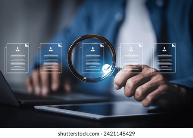 Businessman use magnifying glass focus to human icons for customer focus group. Data exchanges development and customer service , Customer relationship management concept. - Powered by Shutterstock