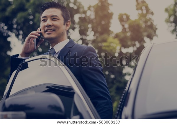 Businessman Use Mobile Talk\
Car