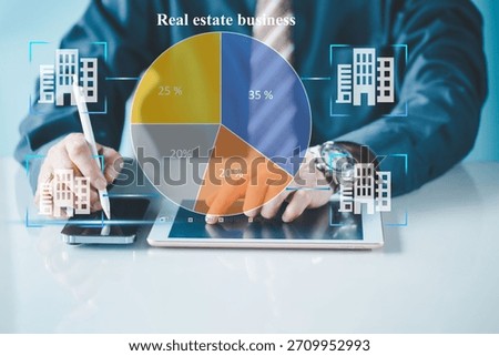 Businessman use a pie chart from data on tablet analysis real estate business , circle diagram. Business analytics concept.