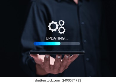 Businessman use smartphone to installing update process. Software updates or operating system upgrades to keep your device up to date with enhanced functionality in new versions and improved security
