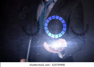 Businessman Use Smartphone And Selecting Loading 100%, Touch Screen. Virtual Icon. Graphs Interface. Business concept. Internet concept. Digital Interfaces - Powered by Shutterstock - Get 15% off with code: PIKWIZARD15
