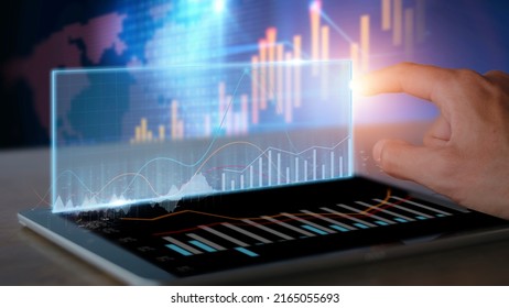 Businessman use tablet analysis graph for trade stock market on the screen Businessman hands use tablet check chart stock growth. Hand male stock graph chart point target success