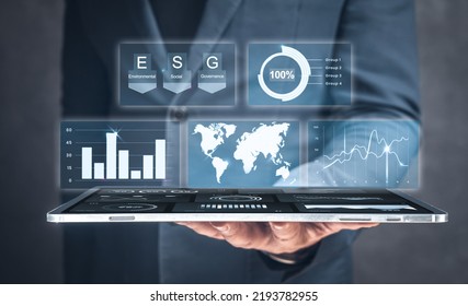 Businessman use tablet for analyze return on investment ESG. ESG environmental social governance business strategy investing concept. Modern digital technologies to analyze latest business principles - Shutterstock ID 2193782955