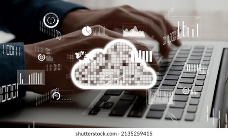 Businessman uses capable laptop computer to connect to cloud computing network for team data sharing on the cloud server and access computer files - Powered by Shutterstock