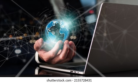 A businessman uses a laptop computer to send digital data using a high-speed internet mobile app. Abstract background of digital change, global internet network connection idea, futuristic technology.