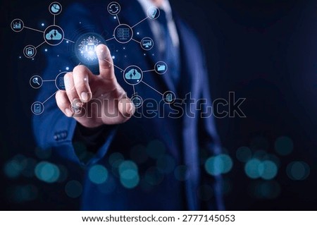 Businessman using AI technology interface with cloud computing, data analytics and cybersecurity icons. Concept of artificial intelligence, digital transformation and smart business systems.