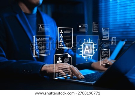 Businessman using AI-powered software on laptop for automated resume screening and candidate selection. Concept of artificial intelligence in HR tech, AI recruitment analytics and digital hiring.