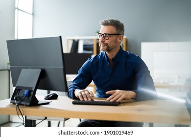 Businessman Using Business Computer In Office Or Workplace