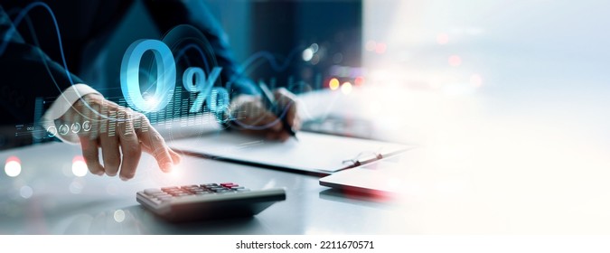 Businessman using a calculator to calculate the numbers with Zero percent sign. Zero percent commission. Economic recession. Interest rate burden. Payment. Discount and no commission. - Shutterstock ID 2211670571