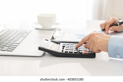 Businessman Using A Calculator To Calculate The Numbers. Accounting , Accountancy, Calculation Concept.