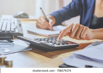 businessman using calculator on desk office business financial accounting concept