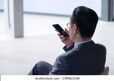 Businessman Using Cellphone To Leave Voice Message. Copy Space.