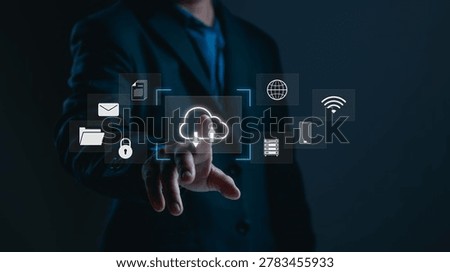 Businessman using cloud computing interface for secure data transfer, concept of online storage, network connectivity and digital cloud technology management in modern business.
